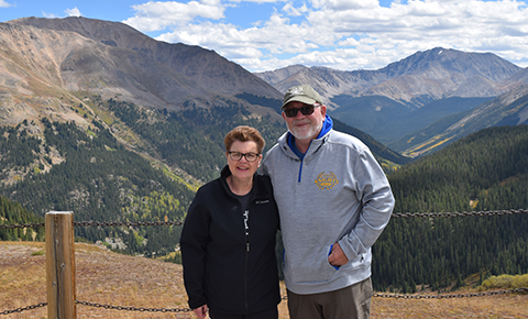 Couple with mountains in background