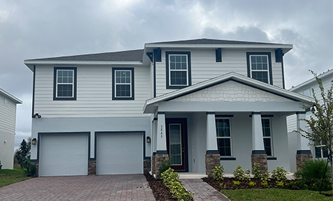 Large white house with double garage